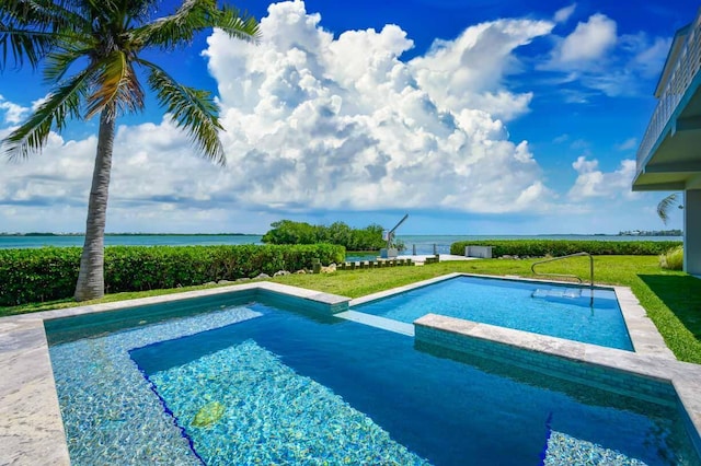 view of swimming pool with a water view and a yard