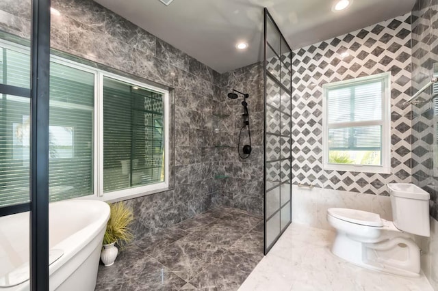 bathroom featuring toilet, separate shower and tub, and tile walls