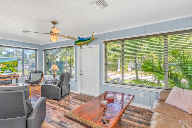 living room with wood ceiling, wood-type flooring, and ceiling fan