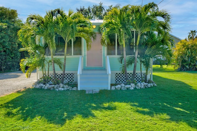 view of side of home featuring a lawn