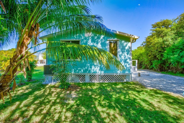 view of side of home featuring a yard