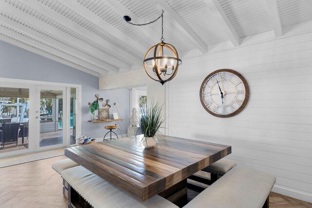 dining space featuring parquet floors, an inviting chandelier, and a wealth of natural light