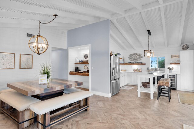 dining area with wine cooler, light parquet flooring, beam ceiling, and a notable chandelier