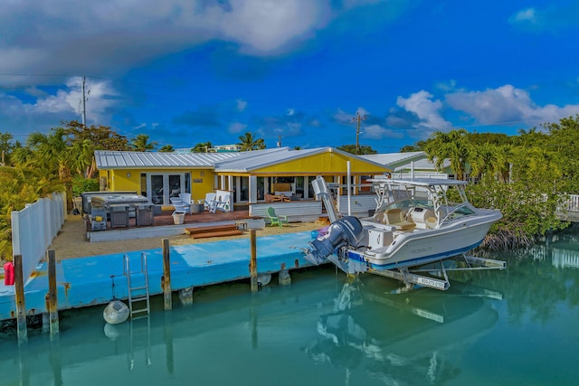 dock area featuring a deck with water view