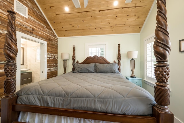 bedroom with vaulted ceiling, ensuite bathroom, and wooden ceiling