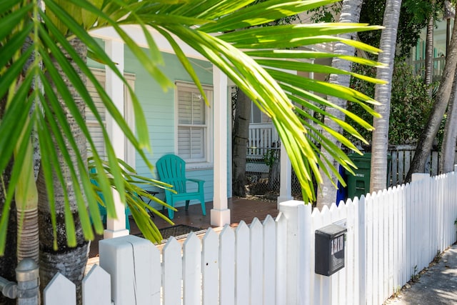 view of side of home with a porch