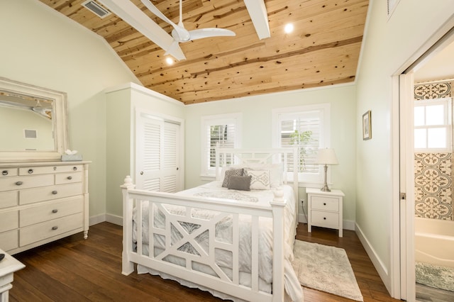 bedroom with dark hardwood / wood-style floors, vaulted ceiling, a closet, and wooden ceiling