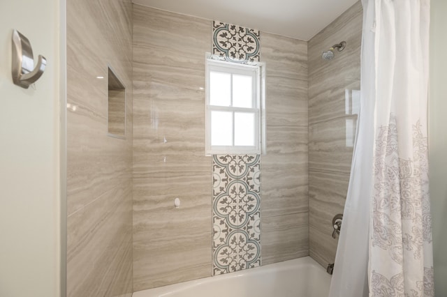 bathroom with shower / tub combo with curtain