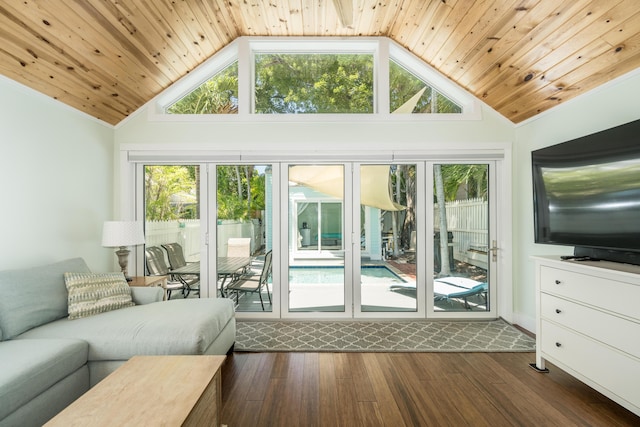 unfurnished living room with high vaulted ceiling, dark wood-type flooring, and wooden ceiling