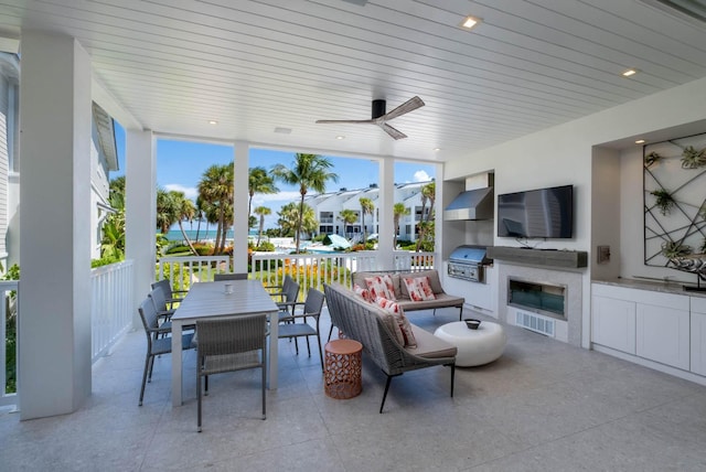 view of patio featuring area for grilling and ceiling fan