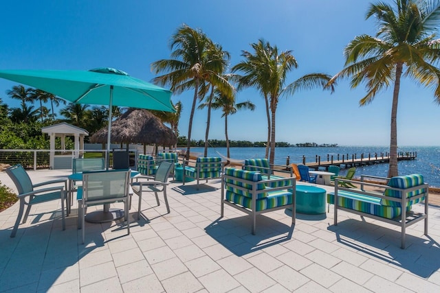 view of patio / terrace with a gazebo and a water view