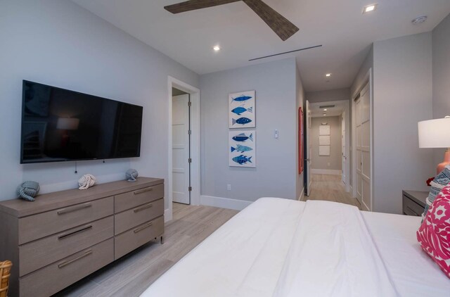 bedroom with ceiling fan and light wood-type flooring