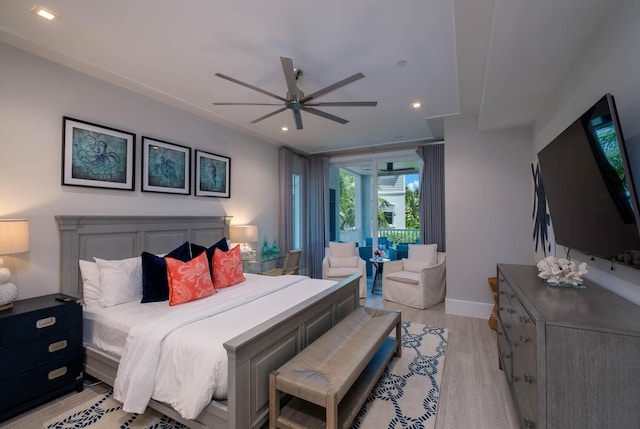 bedroom with light hardwood / wood-style flooring and ceiling fan