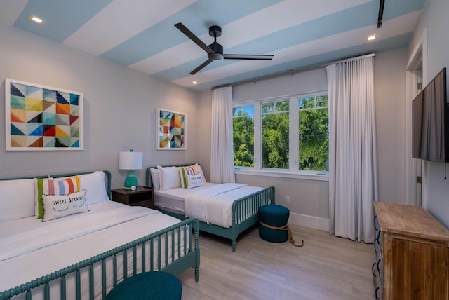 bedroom featuring light hardwood / wood-style flooring and ceiling fan