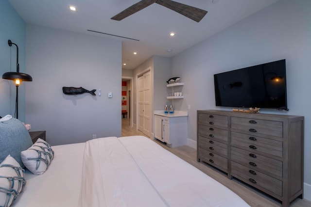 bedroom featuring ceiling fan and light wood-type flooring