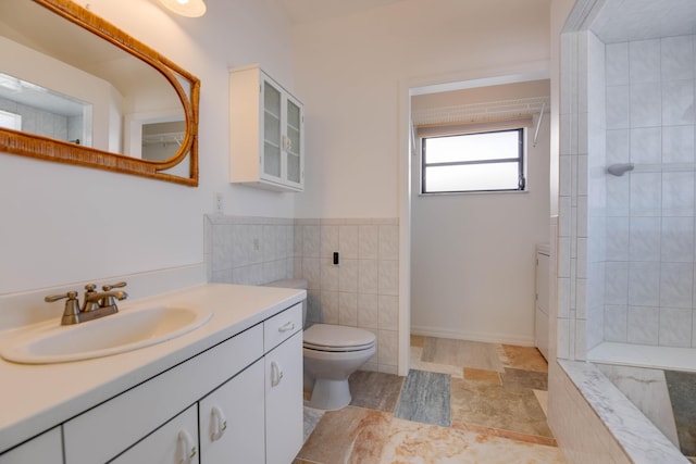 bathroom with vanity, tile walls, a washtub, and toilet