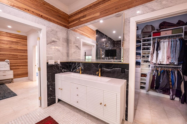 316 Southard St, Key West, FL 33040 - full bathroom featuring tile walls, a spacious closet, vanity, ornamental molding, and tile patterned floors