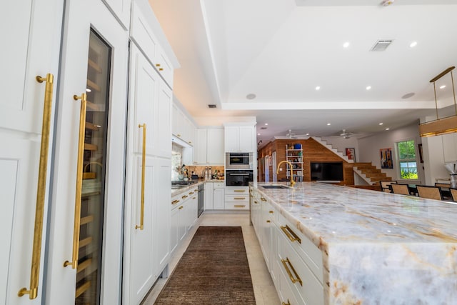 316 Southard St, Key West, FL 33040 - kitchen with a sink, backsplash, open floor plan, light stone countertops, and recessed lighting