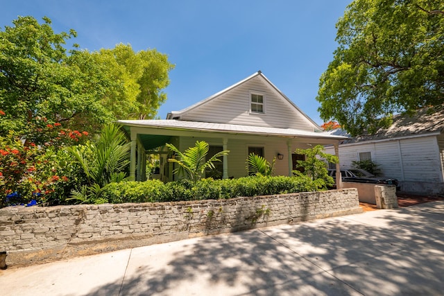 316 Southard St, Key West, FL 33040 - view of front of property featuring a porch and metal roof