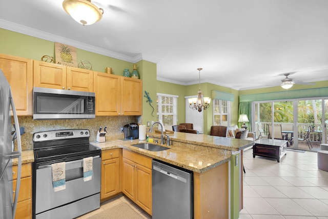 kitchen featuring appliances with stainless steel finishes, kitchen peninsula, sink, and light tile patterned floors