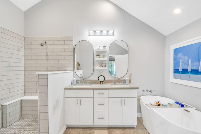 bathroom with vanity, vaulted ceiling, and separate shower and tub