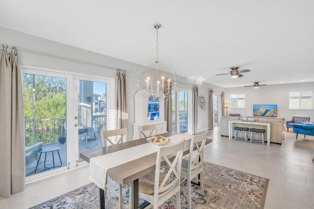 dining area featuring light tile patterned floors, a wealth of natural light, and a chandelier