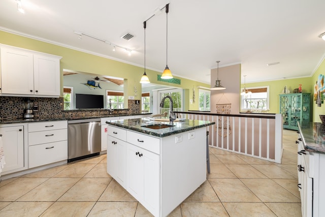 kitchen with decorative light fixtures, white cabinetry, sink, a kitchen island with sink, and stainless steel dishwasher