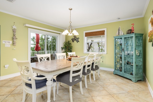 tiled dining space featuring ornamental molding and a chandelier