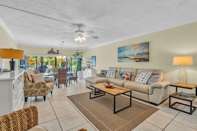 tiled living room with crown molding, ceiling fan with notable chandelier, and a textured ceiling