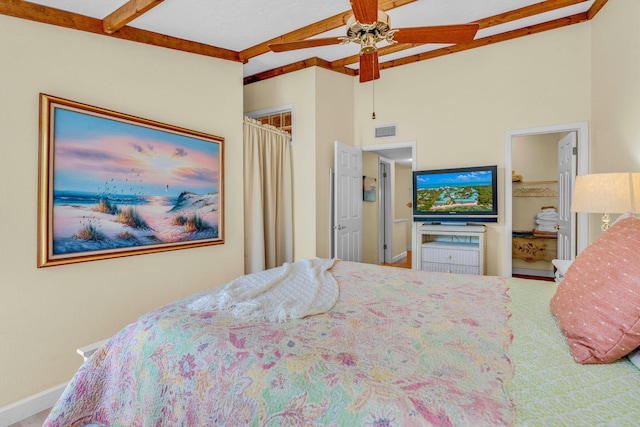 carpeted bedroom featuring lofted ceiling with beams and ceiling fan