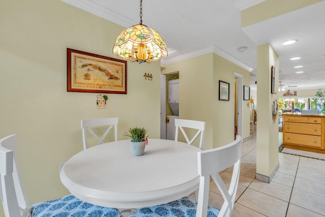 dining room with ornamental molding and light tile patterned floors