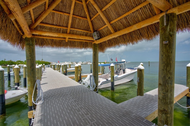 view of dock featuring a water view and a gazebo