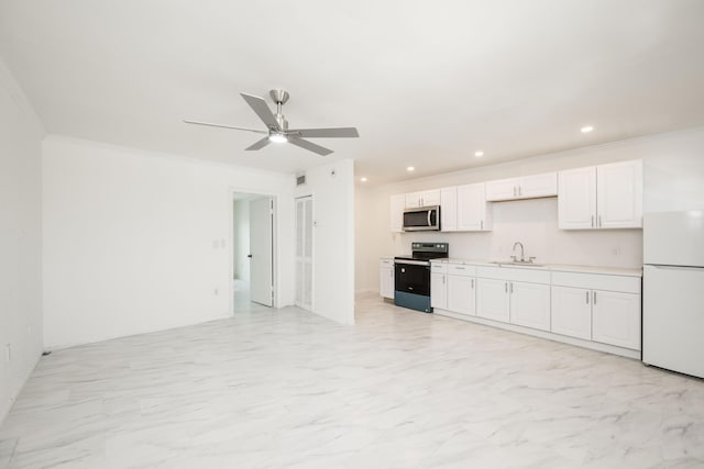 kitchen with white cabinetry, appliances with stainless steel finishes, crown molding, and sink