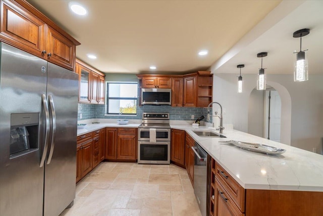 1998 Overseas Hwy Unit A31, Marathon, FL 33050 - kitchen featuring a sink, open shelves, a peninsula, brown cabinets, and stainless steel appliances