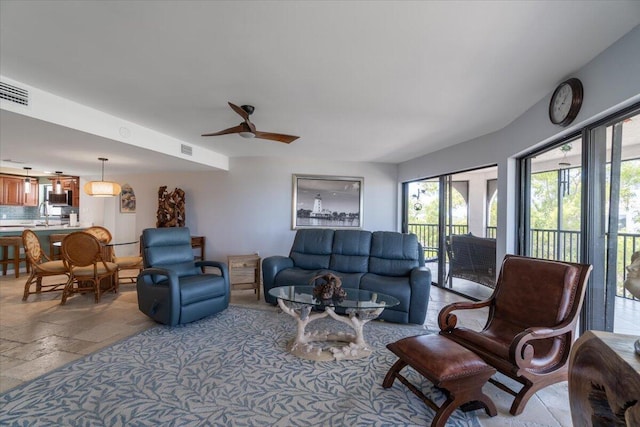 1998 Overseas Hwy Unit A31, Marathon, FL 33050 - living room with ceiling fan, visible vents, and stone tile flooring