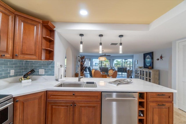 1998 Overseas Hwy Unit A31, Marathon, FL 33050 - kitchen with a peninsula, stainless steel appliances, open shelves, and brown cabinets