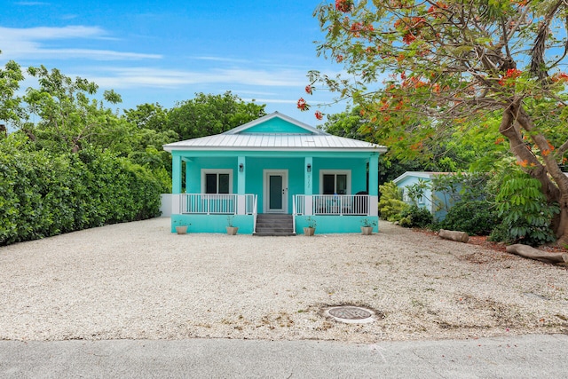 811 La Paloma Rd, Key Largo, FL 33037 - view of front of property with covered porch, metal roof, and a standing seam roof