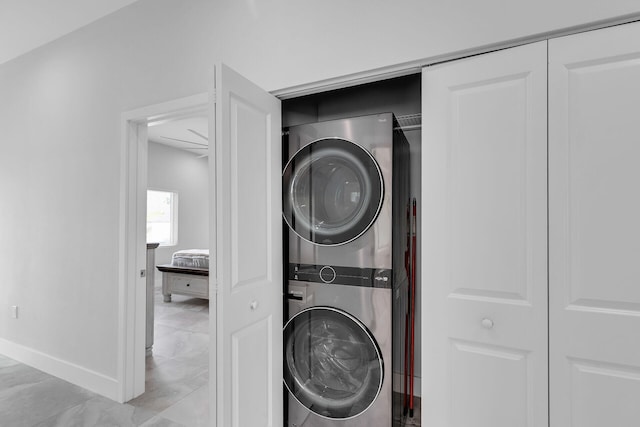 811 La Paloma Rd, Key Largo, FL 33037 - washroom with stacked washer / drying machine and baseboards
