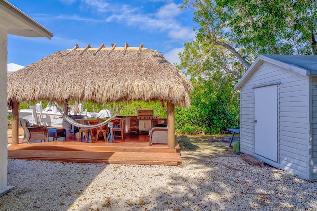 exterior space with a gazebo, a grill, and a deck