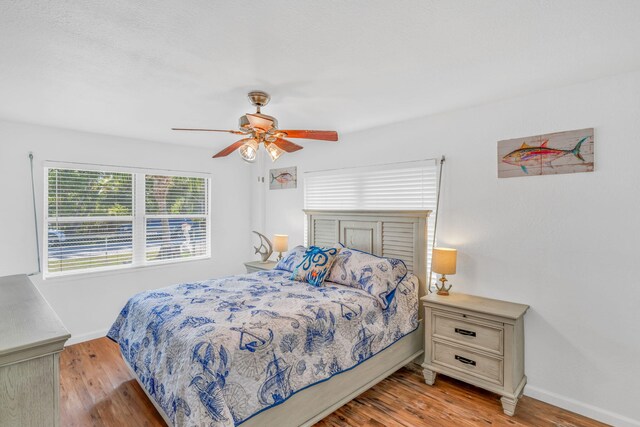 bedroom featuring ceiling fan and light wood-type flooring