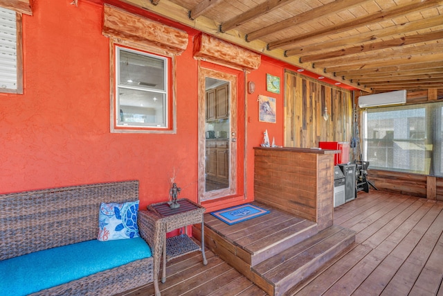 wooden terrace with a wall mounted air conditioner