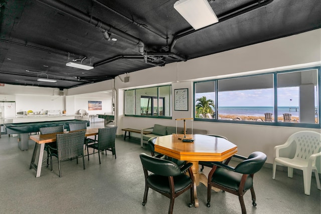 dining space with a water view