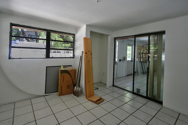 empty room with light tile patterned floors