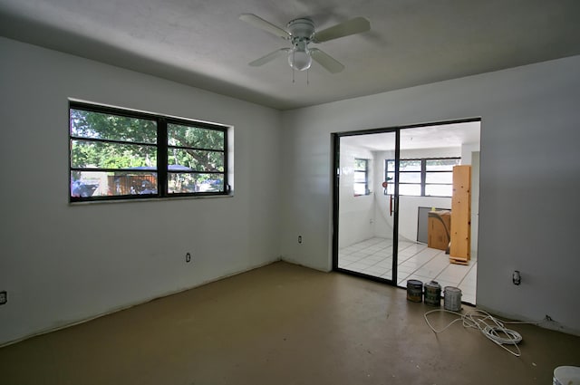 unfurnished room with ceiling fan