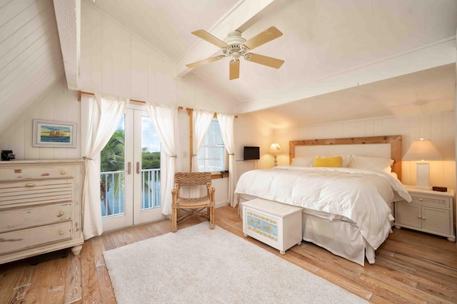 bedroom with ceiling fan, access to exterior, light hardwood / wood-style floors, vaulted ceiling, and french doors