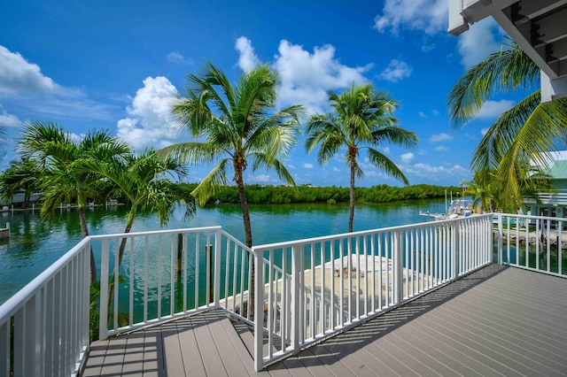 wooden deck with a water view