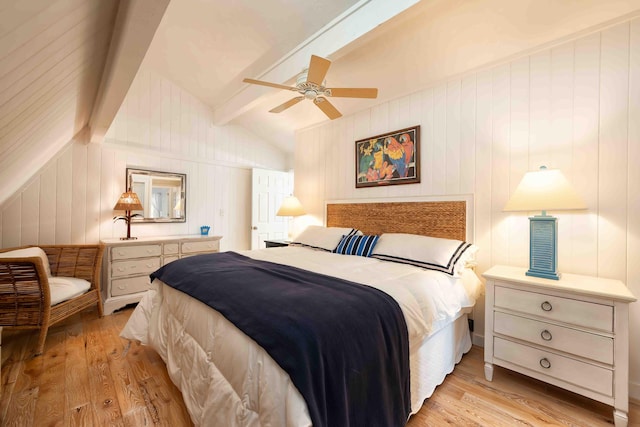 bedroom featuring vaulted ceiling with beams, ceiling fan, and light wood-type flooring