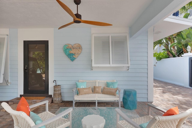 view of patio / terrace featuring ceiling fan