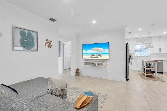 living room featuring light tile patterned floors and ornamental molding