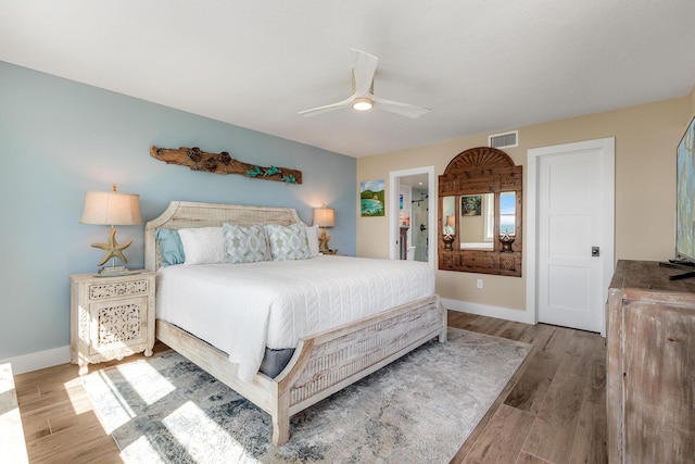 bedroom featuring hardwood / wood-style flooring and ceiling fan